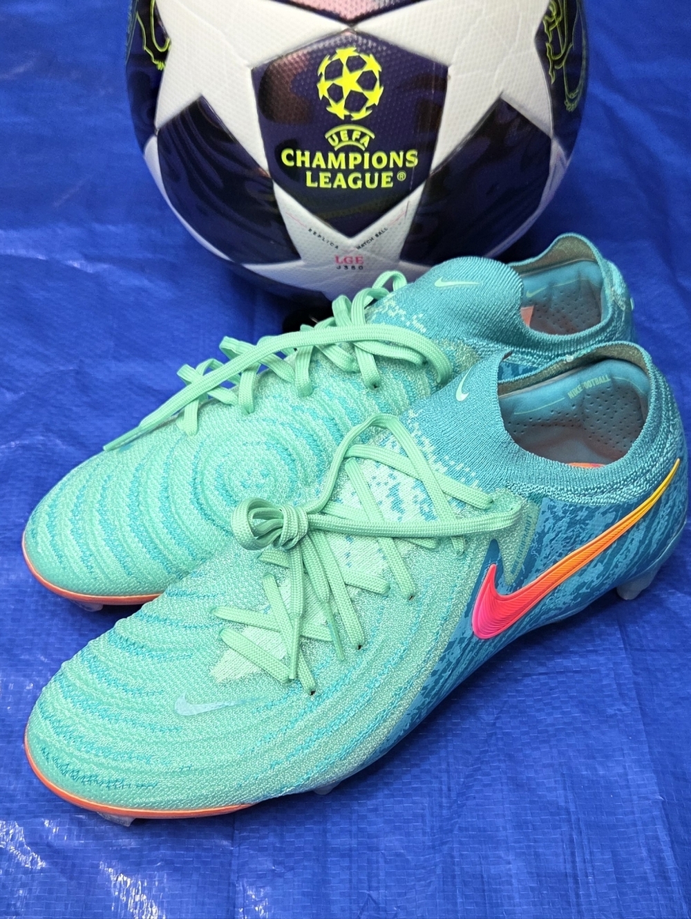Nike Teal/Turquoise Soccer Cleats with Pink/Orange Swoosh